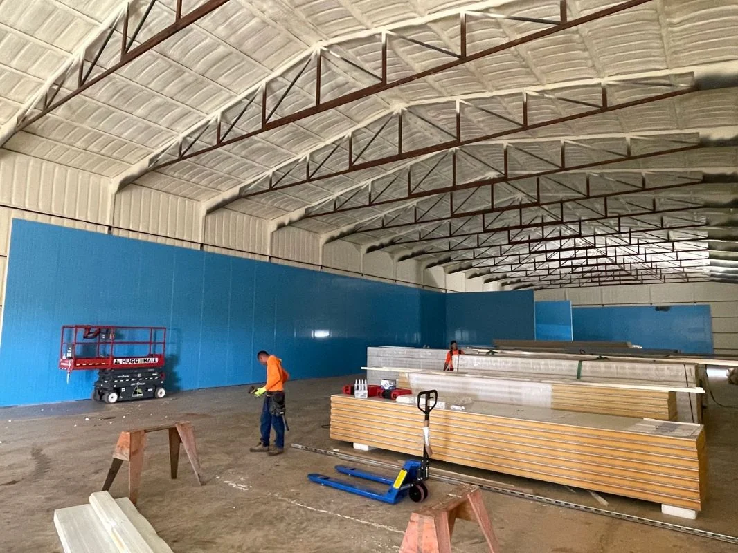 Large facility with arched roof and new Insulated Metal Panel (IMP) walls