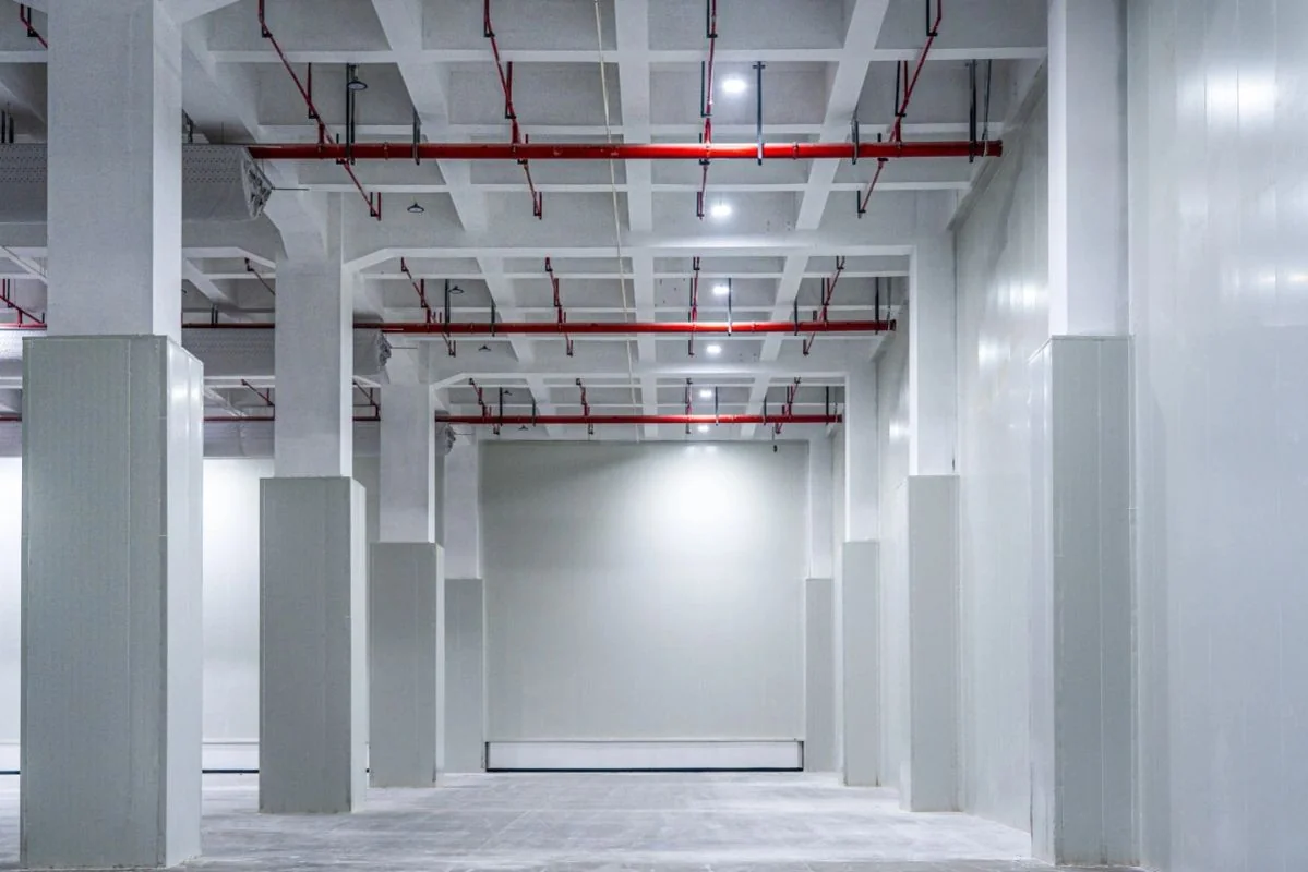 Cold storage corridor with Insulated Metal Panel (IMP) walls and overhead services