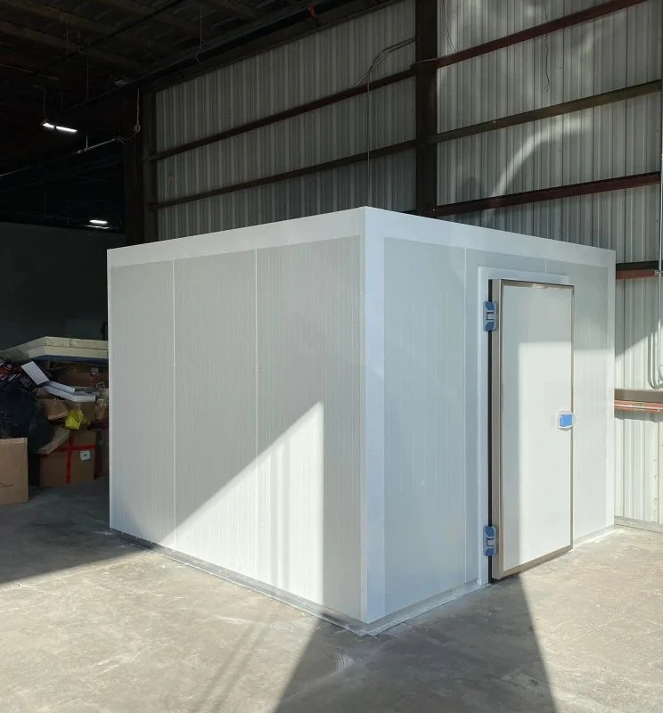 Walk-in insulated room built from Insulated Metal Panels (IMP) inside a warehouse